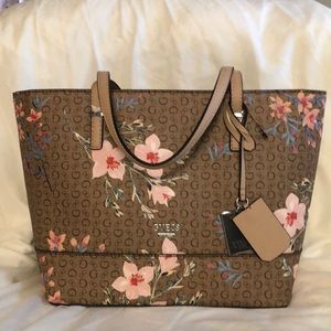 NWT Guess hand bag tan, with pink, blue and peach flowers